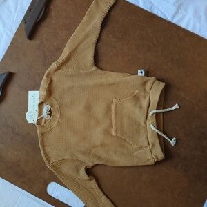 Sweatshirt with one pocket and tie. Color peanut tan size 12M 100 percent cotton